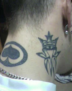 King in crown tattoo on neck