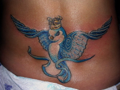 Crowned blue bird lower back tattoo