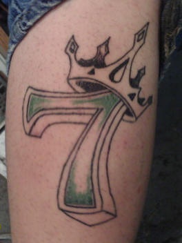 Crowned number seven tattoo