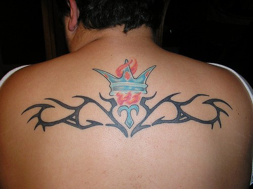 Tribal tattoo with crown and flame