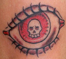 Death in eye coloured  tattoo