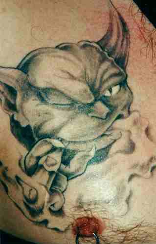 Smoking green demon tattoo