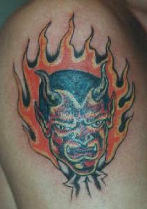 Red demon in flames tattoo