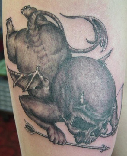 cherubino demonio nero raccapricciante tatuaggio