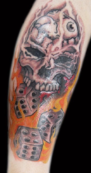 Dice skull in flame tattoo