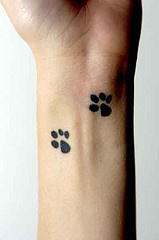 Doggy paw prints wrist tattoo