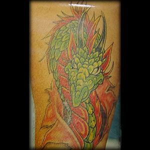 Green middle age dragon tattoo