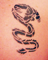 Dragon print black ink tattoo