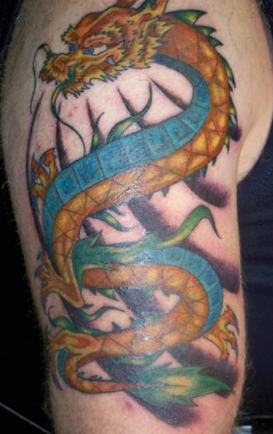 Blue and yellow dragon arm tattoo