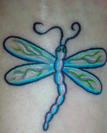 Minimalistic dragonfly tattoo