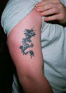 Small black ink dragon tattoo