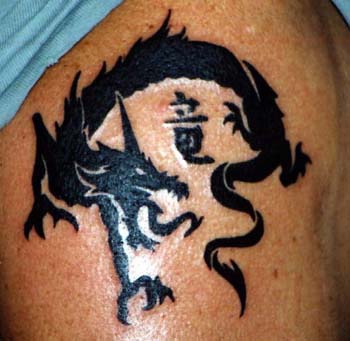 Black dragon with hieroglyph tattoo