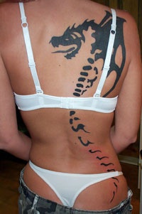 Large bone dragon black ink tattoo