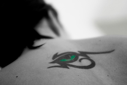 Green eye of horus tribal tattoo