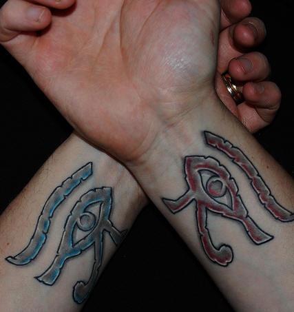 Egyptian eye of ra tattoos on wrists