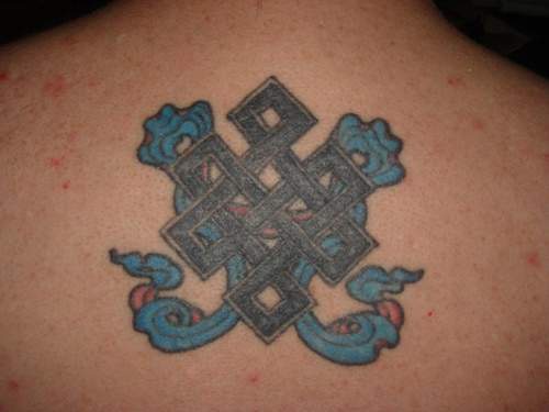 Heraldic knot tracery tattoo
