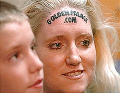 Stupid commercial tattoo on forehead