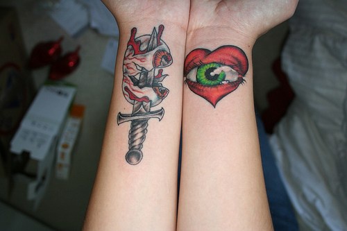 Eyeball on knife and heart with eye in colour