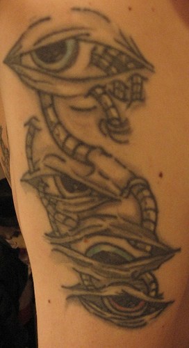 Biomech eyes black ink tattoo