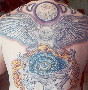 Eye deity with owl and moon tattoo on back