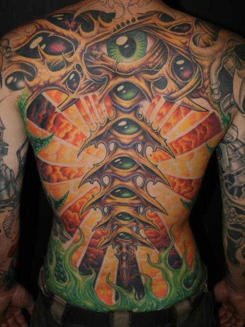 Eyeballs in biomech full back art tattoo