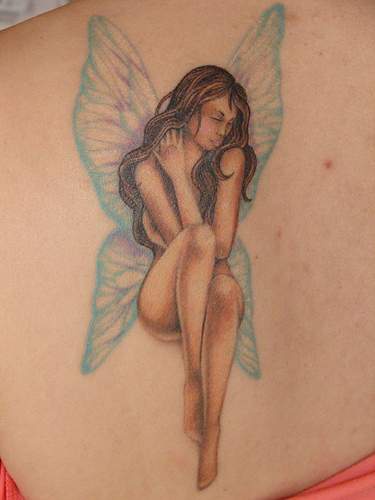 Fairy with crystalline wings on shoulder