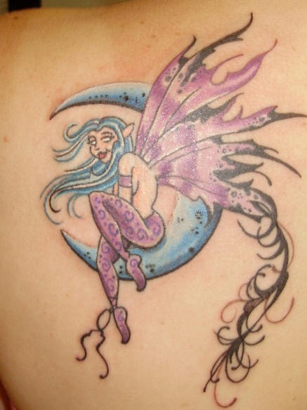 Fairy on blue crescent tattoo