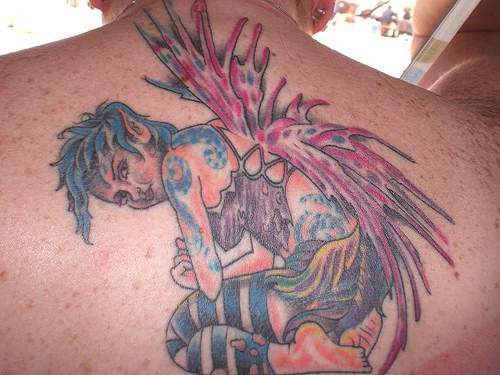 Wild fairy tattoo on back