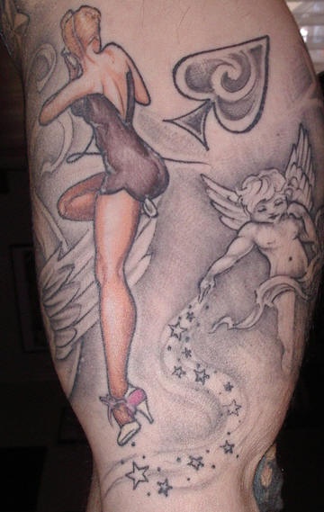 Naked woman cherub and spade tattoo