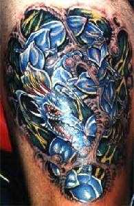 Amazing flower serpent coloured tattoo