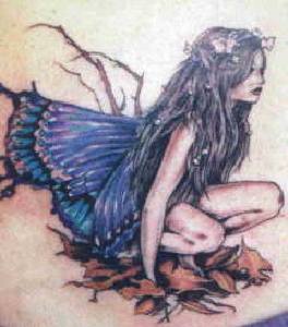 Sad fairy in fallen leaves tattoo