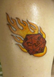 Game dice on fire tattoo