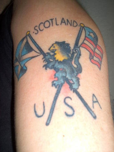 Usa and scotland flags and lion tattoo