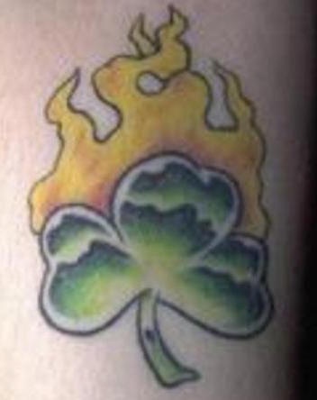 Flaming shamrock coloured tattoo