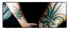 Coloured fleur de lis tattoo
