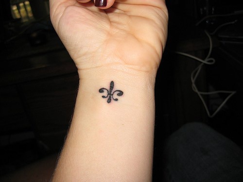 Fleur de lis small wrist tattoo