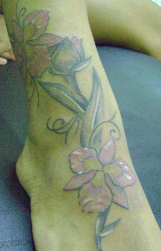 Big colourful orchids with bud foot tattoo