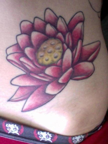 Pink,colourful lush lily flower hip tattoo