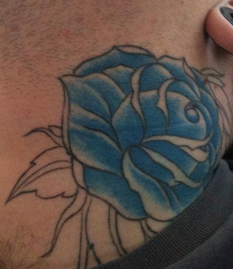 Undone blue rose tattoo