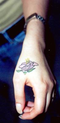 Purple flower tattoo on hand