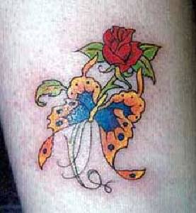 Red rose and yellow butterfly tattoo