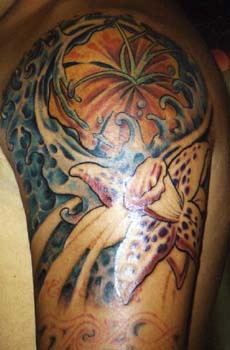 Flower in sea  tattoo on shoulder