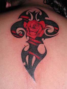 Red rose in black tribal tattoo