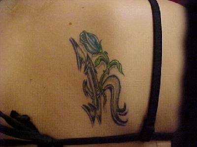 Flower as monogram tattoo