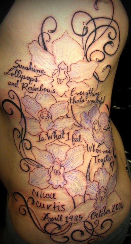 Flowers and kid names on it tattoo