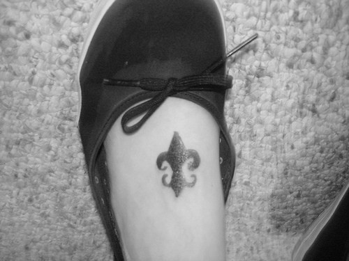 Fluer de lis tattoo on foot