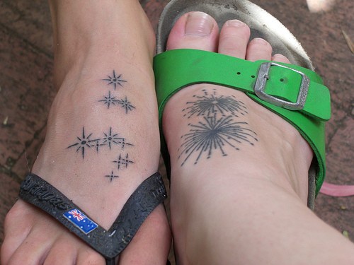 Uncoloured different firework flashes foot tattoo