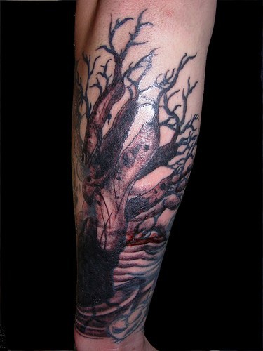 Awful mystic monster&quots black tree forearm tattoo