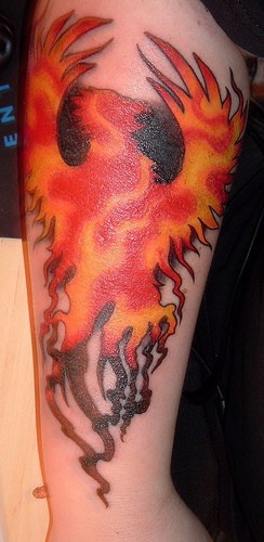 Big beautiful flame-coloured phoenix with shade forearm tattoo