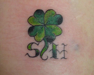 Initials with four leaf clover tattoo